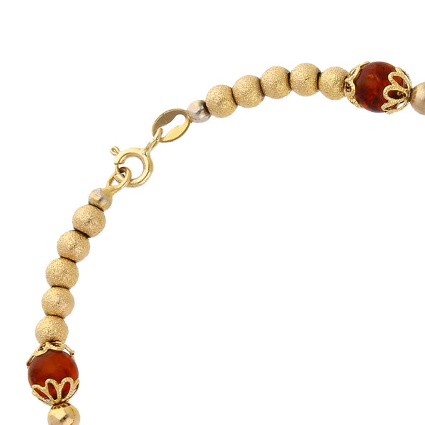 Pulsera eslabón boleado combinado con ambar en oro amarillo 14 kilates.