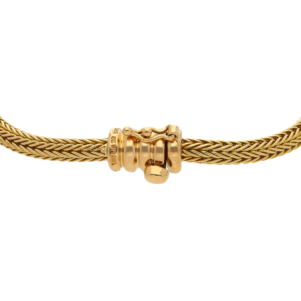 Pulsera eslabón tejido firma Tane en oro amarillo 18 kilates.