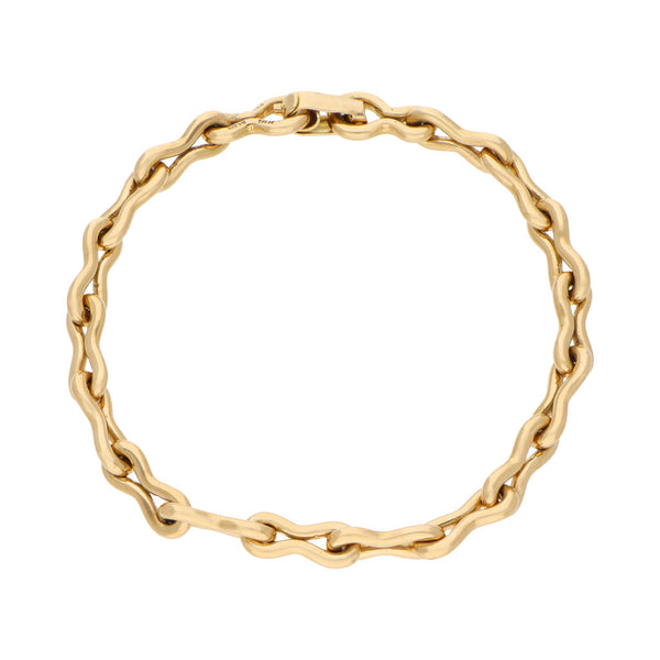 Pulsera eslabón cruzado firma Tane en oro amarillo 18 kilates.