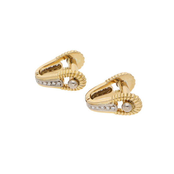 Mancuernillas diseño especial con diamantes en oro amarillo 18 kilates.