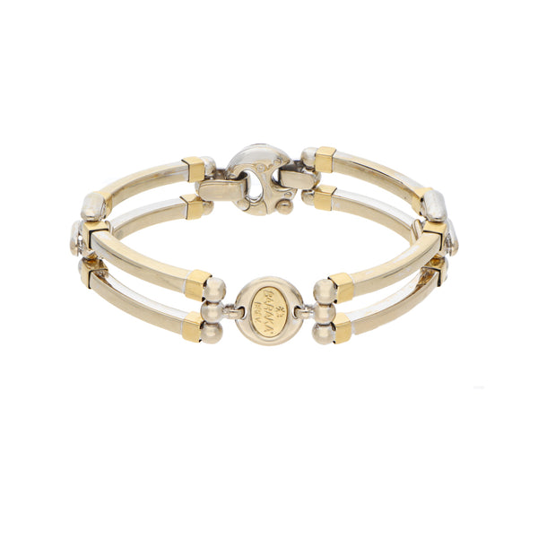 Pulsera eslabón articulado combinado con aplicación en oro dos tonos 18 kilates.