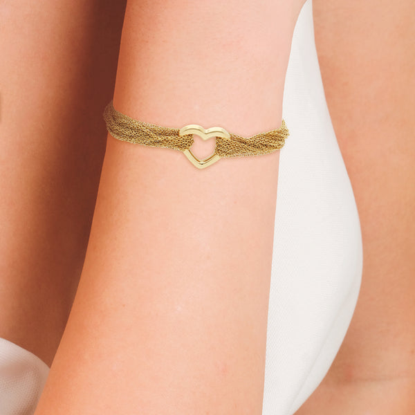 Pulsera doce hilos eslabón cruzado firma Tiffany & Co. con aplicación motivo corazón en oro amarillo 18 kilates.