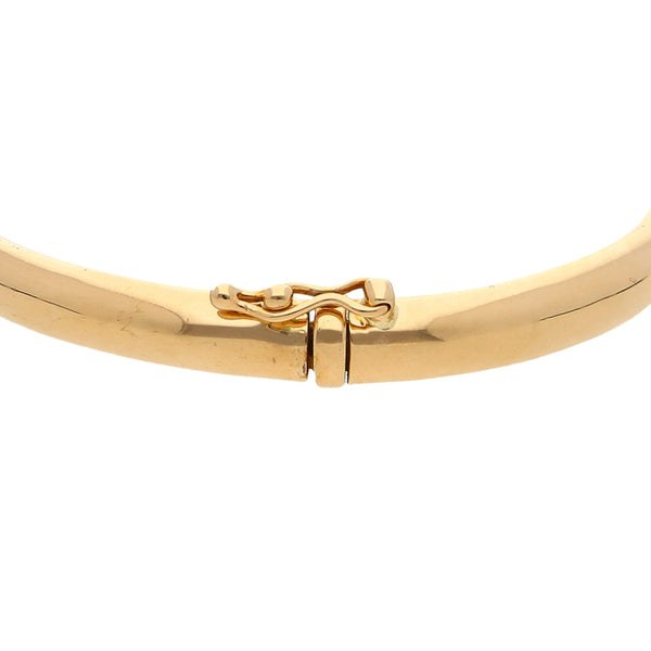 Pulsera ovalada articulada con aplicación firma Tane en oro amarillo 18 kilates.