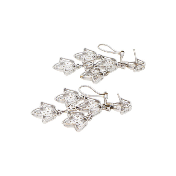 Aretes articulados con diamantes en oro blanco 18 kilates.