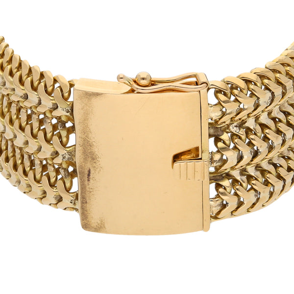 Pulsera eslabón tejido en oro amarillo 18 kilates.