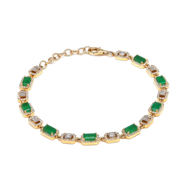 Pulsera eslabón cruzado combinado con diamantes y esmeraldas en oro amarillo 14 kilates.