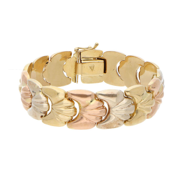 Pulsera eslabón articulado hueco en oro tres tonos 18 kilates.