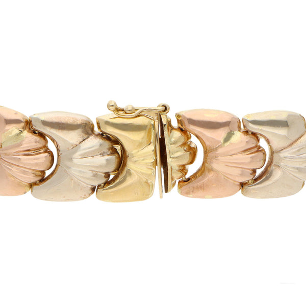 Pulsera eslabón articulado hueco en oro tres tonos 18 kilates.
