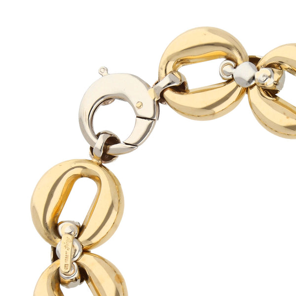 Pulsera eslabón cruzado combinado en oro dos tonos 14 kilates.