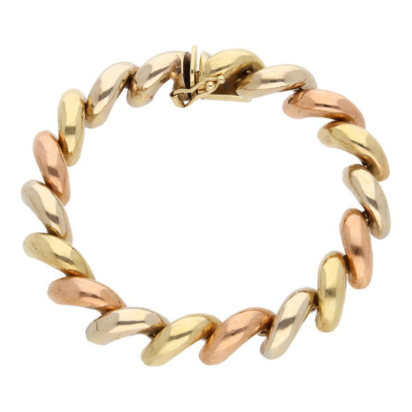 Pulsera eslabón articulado en oro tres tonos 14 kilates.