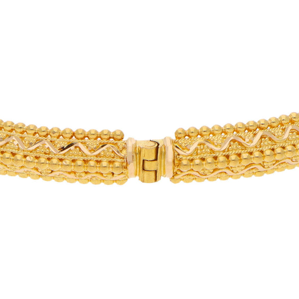 Pulsera de arillo estilizada en oro amarillo 21 kilates.