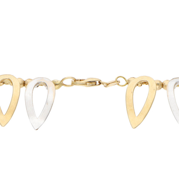 Pulsera eslabón combinado con colgantes en oro dos tonos 14 kilates.