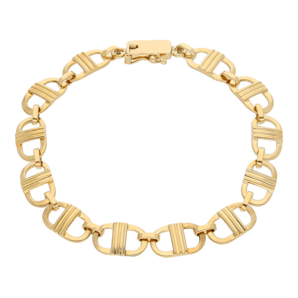 Pulsera eslabón combinado en oro amarillo 18 kilates.