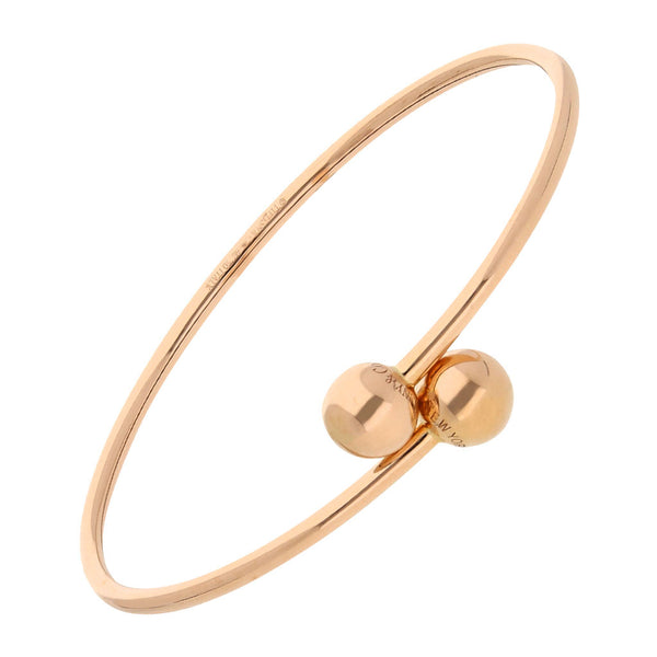 Pulsera de arillo ovalada abierta firma Tiffany & Co en oro rosa 18 kilates.