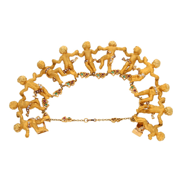 Pulsera eslabón combinado motivo niños con diamantes y gemas firma Carrera y Carrera en oro amarillo 18 kilates.