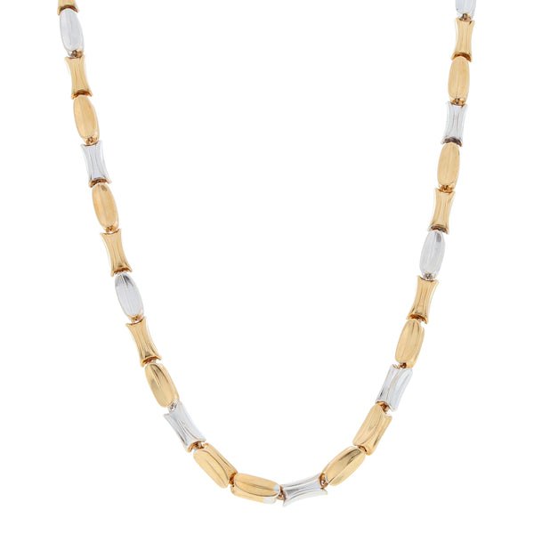 Collar eslabón cruzado hueco en oro dos tonos 18 kilates.