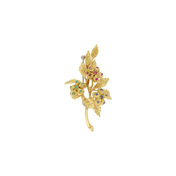 Prendedor diseño especial motivo floral con sintéticos en oro amarillo 18 kilates.