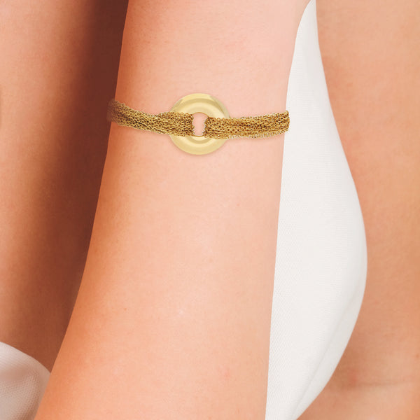 Pulsera trece hilos eslabón cruzado con aplicacion firma Tiffany & Co. en oro amarillo 18 kilates.