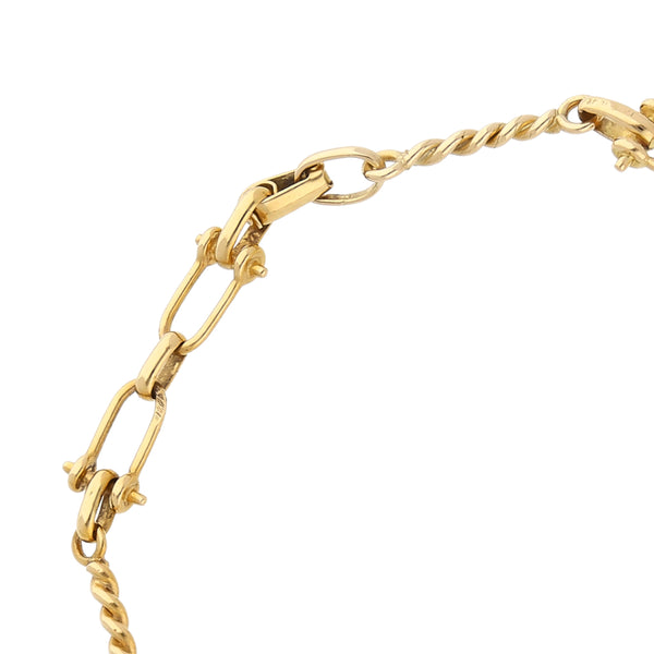 Pulsera eslabón combinado firma Tane en oro amarillo 18 kilates.