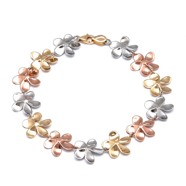 Pulsera eslabón laminado motivo floral en oro tres tonos 14 kilates.