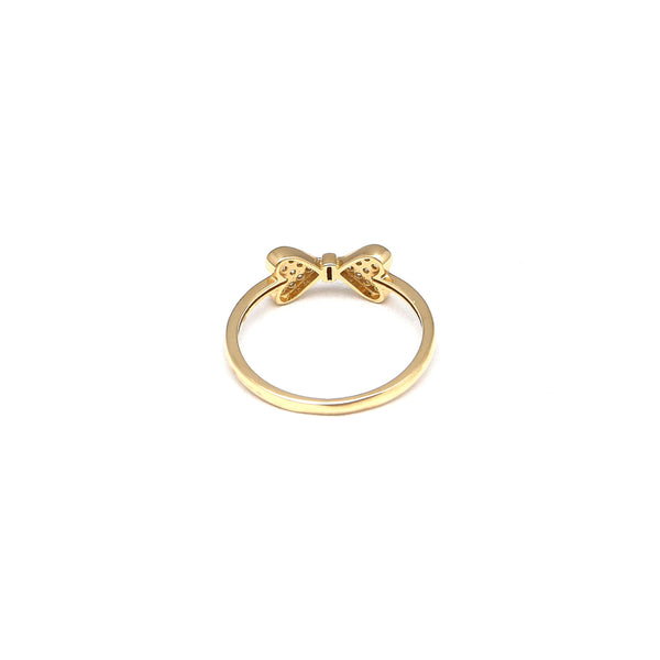 Anillo diseño especial motivo moño con circonias en oro amarillo 14 kilates.