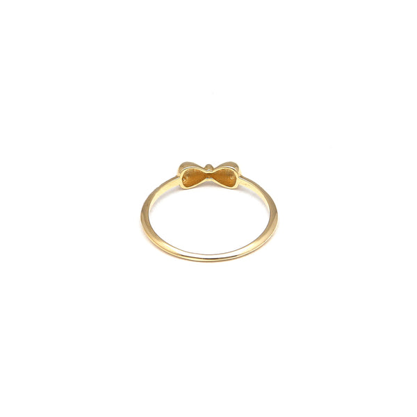 Anillo diseño especial motivo moño en oro amarillo 14 kilates.