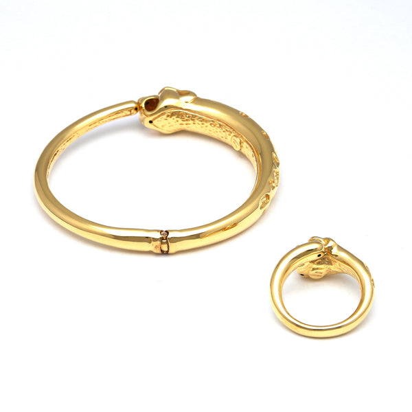 Juego de pulsera de arillo articulada hueca y anillo estilizado hueco motivo felino en oro amarillo 14 kilates.