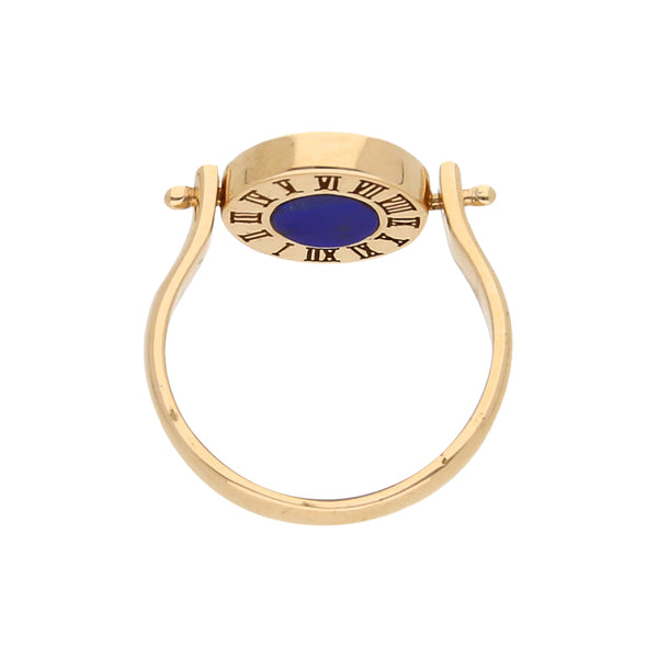 Anillo copete giratorio con esmalte, lapislazuli y ónix en oro amarillo 14 kilates.