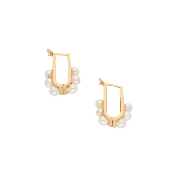 Aretes articulados con perlas en oro amarillo 14 kilates.