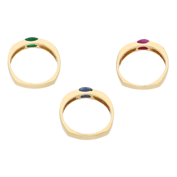 Tres anillos diseño especial con esmeralda, rubí y zafiro en oro amarillo 14 kilates.