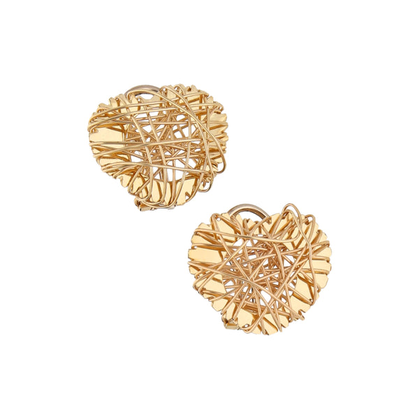 Aretes calados motivo corazón en oro amarillo 14 kilates.