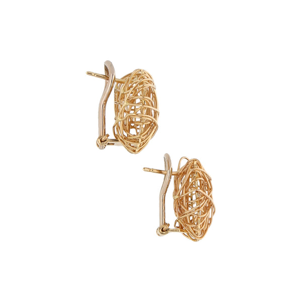 Aretes calados motivo corazón en oro amarillo 14 kilates.