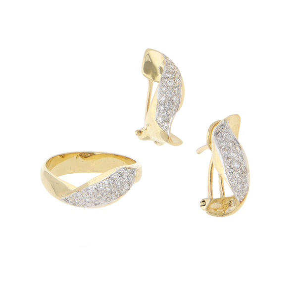 Juego de anillo y aretes estilizados con diamantes en oro amarillo 14 kilates.