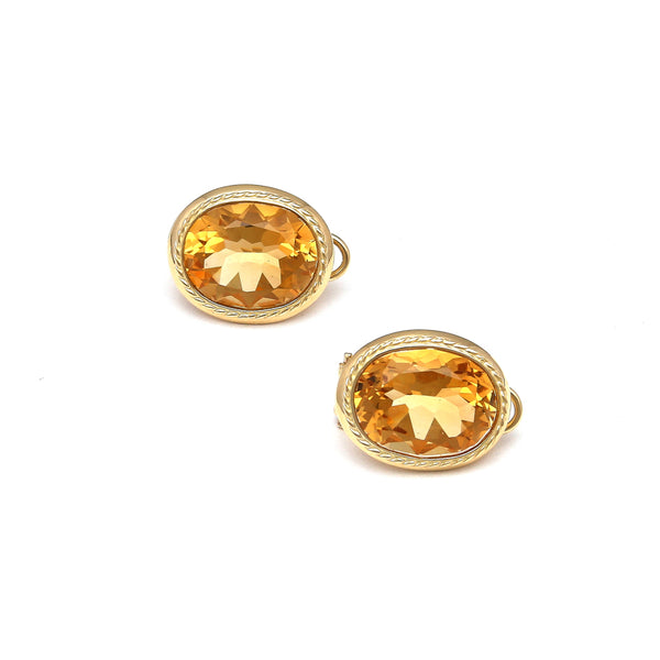 Aretes diseño especial con citrinos en oro amarillo 14 kilates.