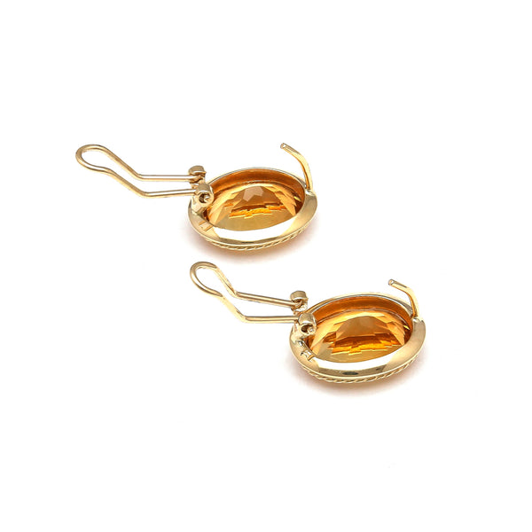 Aretes diseño especial con citrinos en oro amarillo 14 kilates.