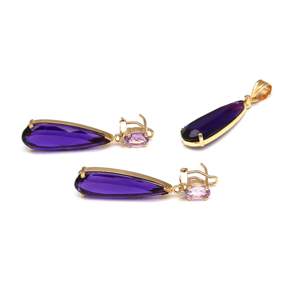 Juego de dije y aretes diseño especial con diamantes y amatista en oro amarillo 14 kilates.