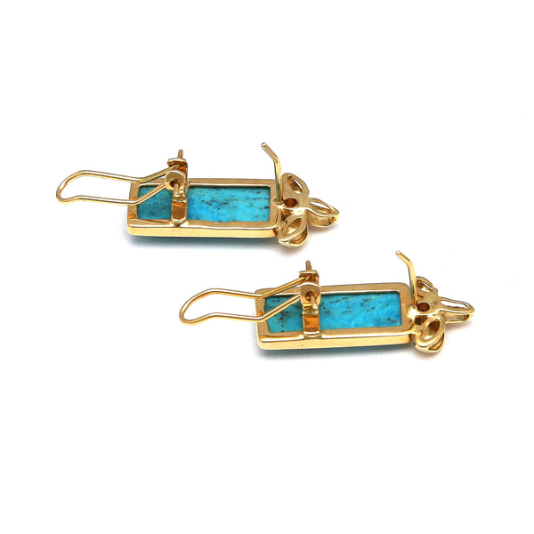 Aretes estilizados con turquesas y circonias en oro amarillo 14 kilates.