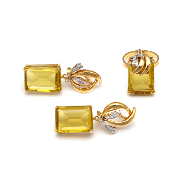 Juego de anillo y aretes estilizados con diamantes y citrinos miel en oro amarillo 14 kilates.