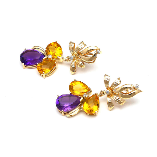 Aretes estilizados con amatista, citrinos y circonias en oro amarillo 14 kilates.