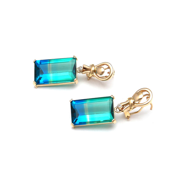 Aretes estilizados con obsidiana bicolor y circonia en oro amarillo 14 kilates.