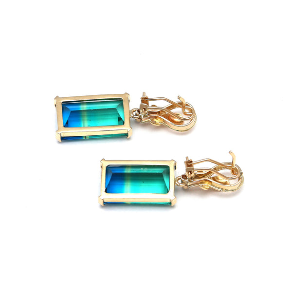 Aretes estilizados con obsidiana bicolor y circonia en oro amarillo 14 kilates.
