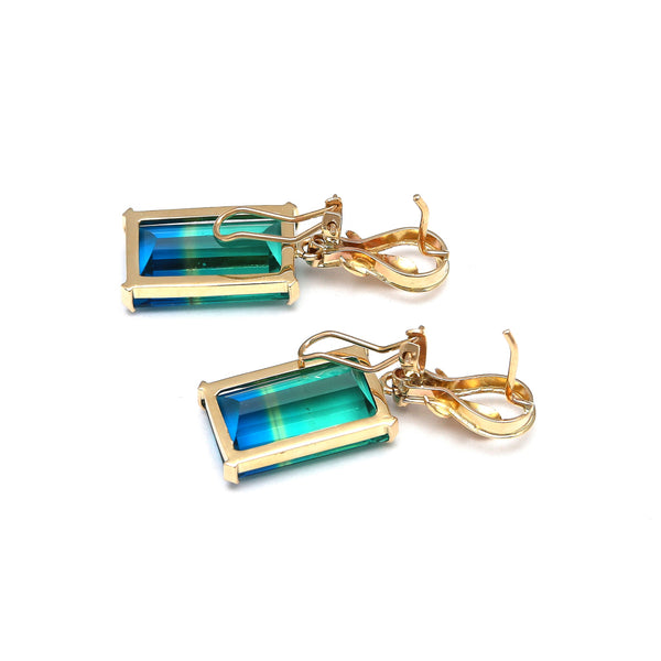 Aretes estilizados con obsidiana bicolor y circonia en oro amarillo 14 kilates.