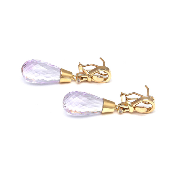 Aretes estilizados con amatistas lavanda y circonias en oro amarillo 14 kilates.