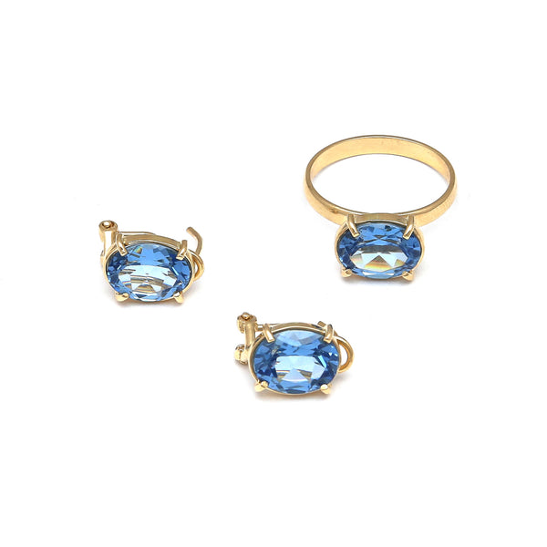 Juego de anillo y aretes diseño especial con topacios London blue en oro amarillo 14 kilates.