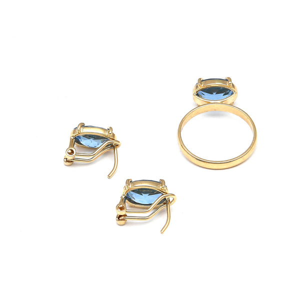 Juego de anillo y aretes diseño especial con topacios London blue en oro amarillo 14 kilates.