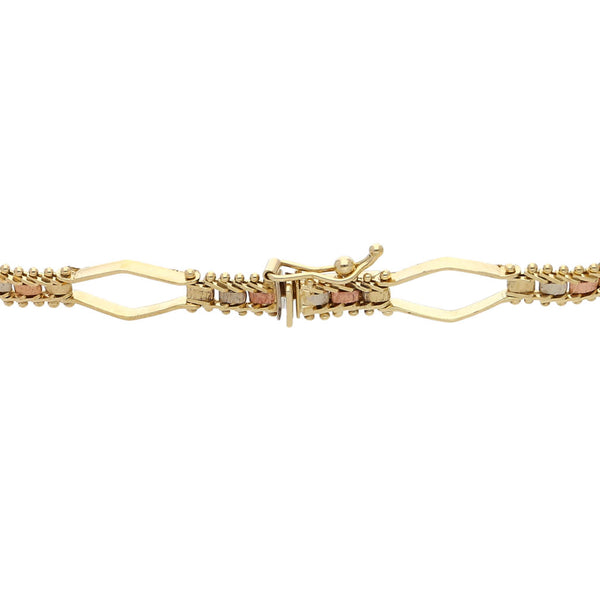 Pulsera eslabón combinado en oro tres tonos 14 kilates.