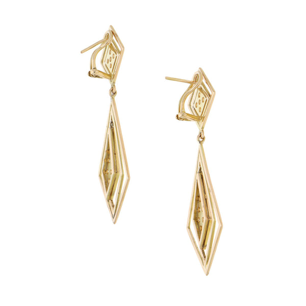 Aretes estilizados articulados con diamantes en oro amarillo 14 kilates.