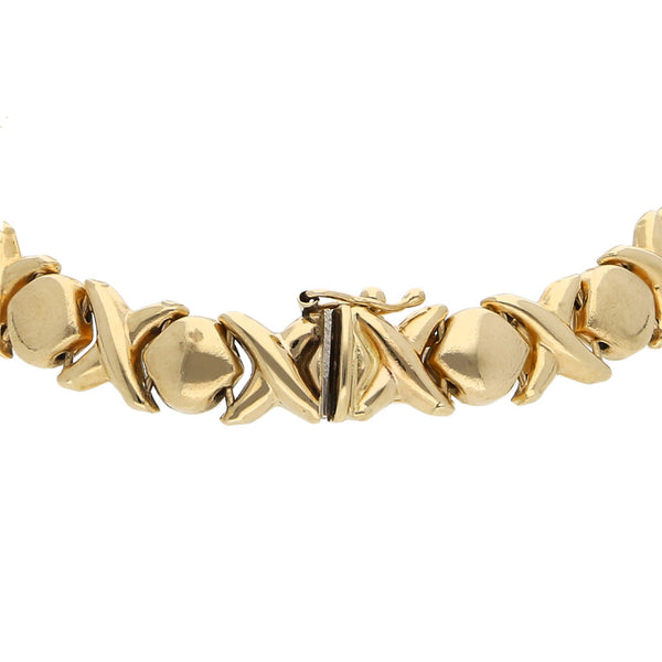 Pulsera eslabón XOXO en oro amarillo 14 kilates.