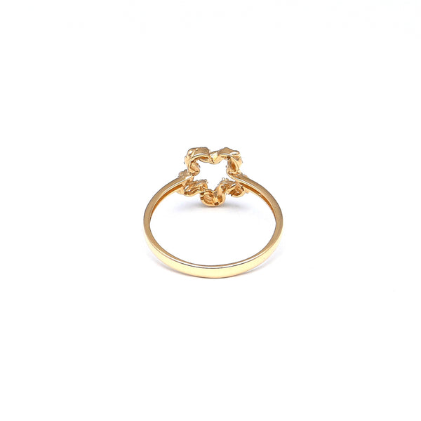 Anillo calado con circonias en oro amarillo 14 kilates.