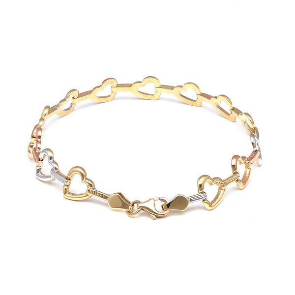 Pulsera eslabón combinado motivo corazones en oro amarillo 14 kilates.